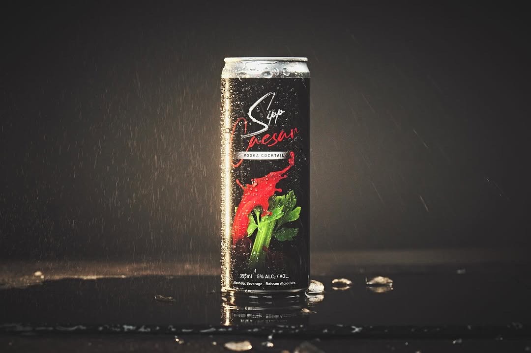 Sipp Caesar can on a wet surface in dramatic side lighting